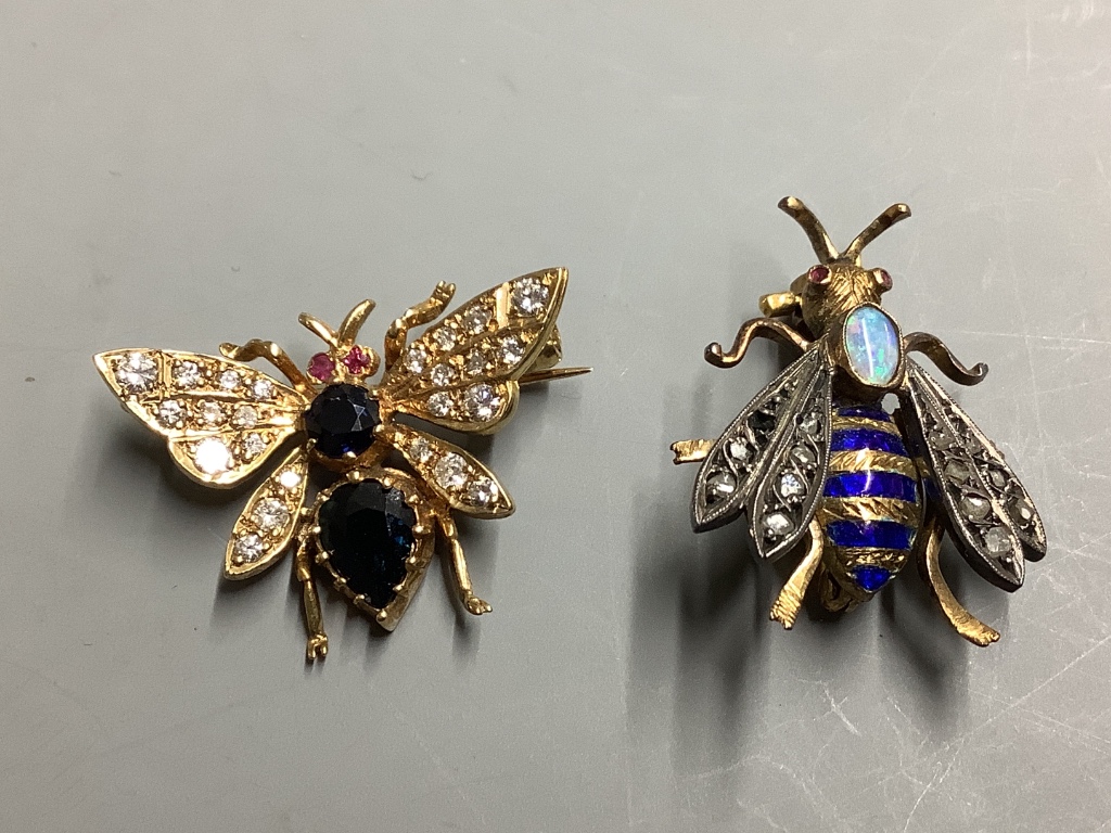 Two diamond and gemstone-set yellow metal insect brooches, largest 25mm, gross 7.8 grams and a silver and amber foliate openwork brooch